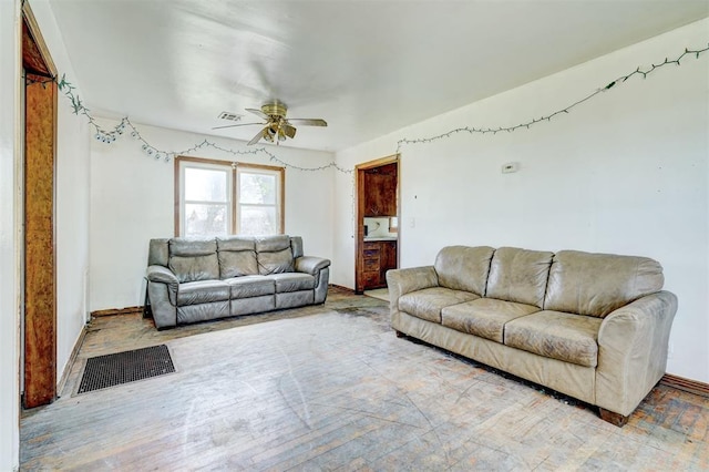 living room with light hardwood / wood-style floors and ceiling fan