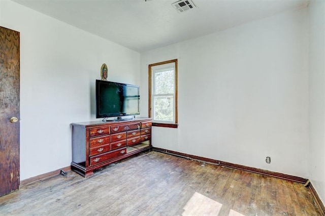 bedroom with light hardwood / wood-style flooring