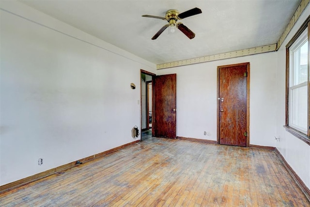 unfurnished bedroom with ceiling fan and light hardwood / wood-style flooring