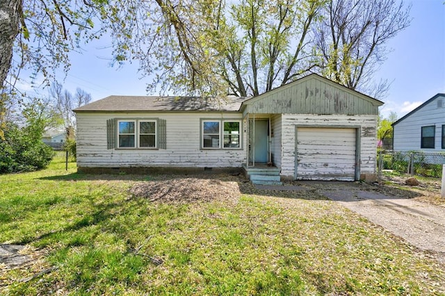 single story home with a garage and a front yard