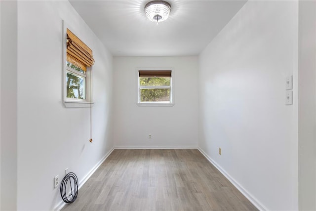 spare room featuring light wood-type flooring