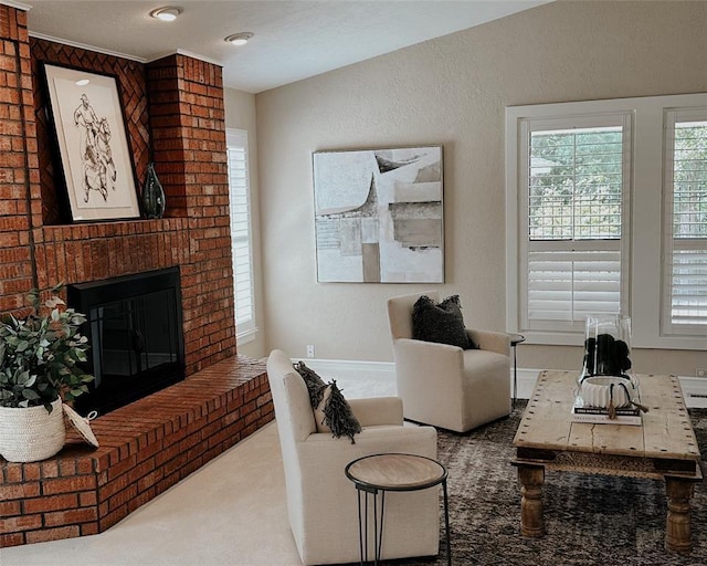 carpeted living room featuring a brick fireplace