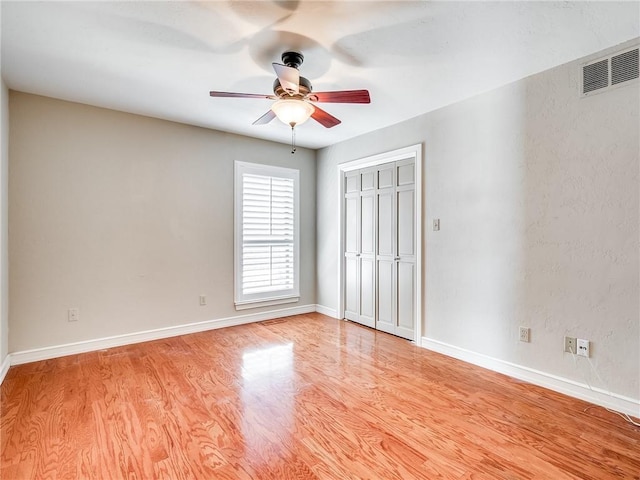 unfurnished bedroom featuring light hardwood / wood-style floors and ceiling fan