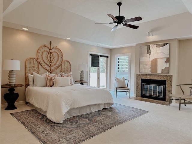 bedroom with access to exterior, ceiling fan, carpet floors, and lofted ceiling