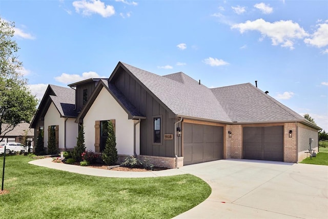 view of front of house featuring a garage and a front lawn