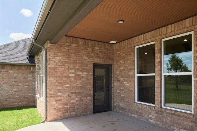 property entrance with a patio area