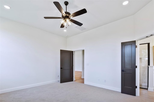 unfurnished bedroom with ceiling fan and light carpet