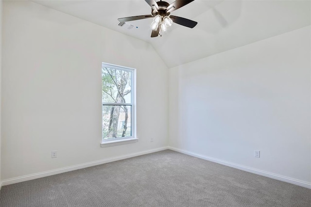 empty room with carpet flooring, ceiling fan, and lofted ceiling