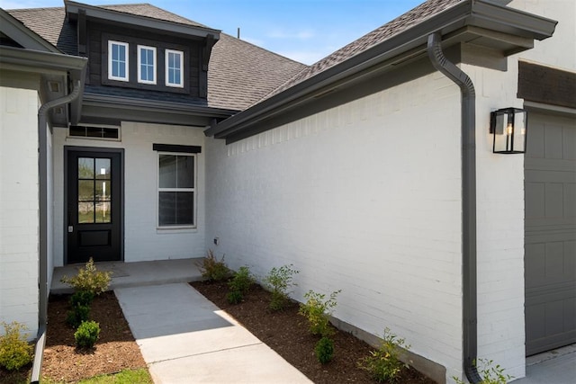 entrance to property featuring a garage