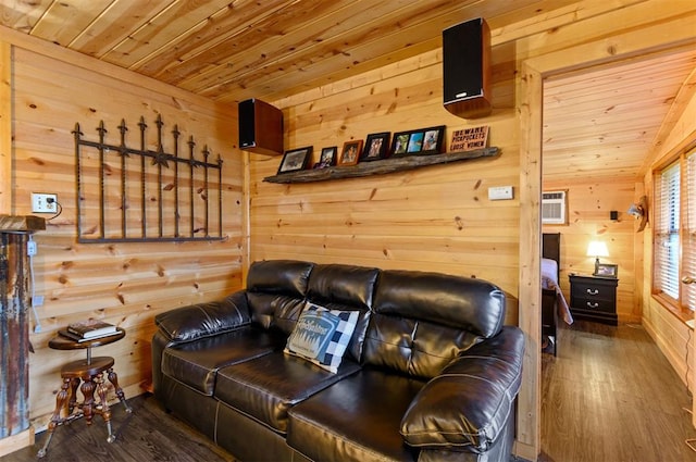 cinema room with lofted ceiling, dark hardwood / wood-style flooring, wooden ceiling, and wooden walls