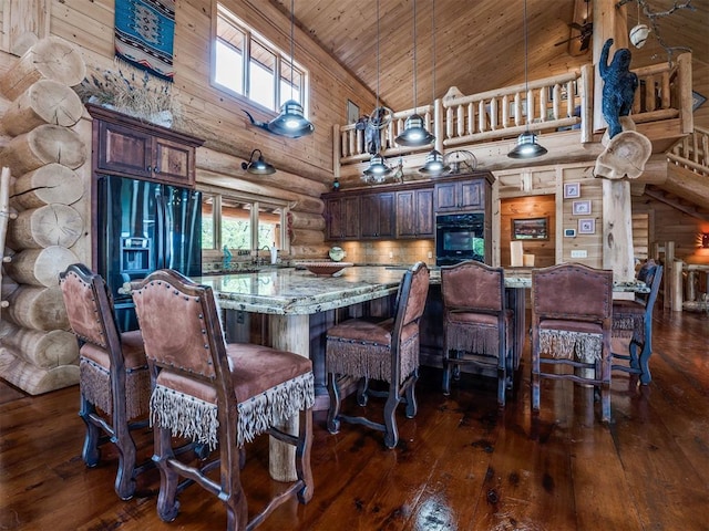 dining room with log walls, dark hardwood / wood-style floors, wood walls, high vaulted ceiling, and wooden ceiling