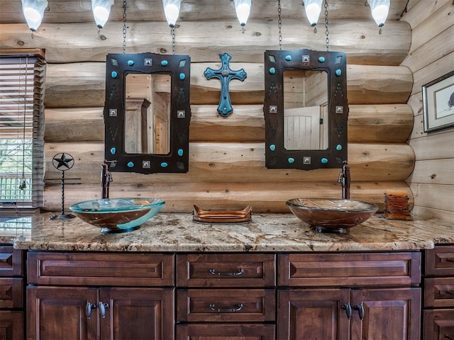 bar with light stone counters and log walls