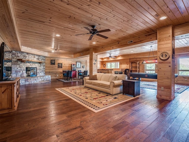 living room with wooden ceiling, dark hardwood / wood-style flooring, wooden walls, and ceiling fan