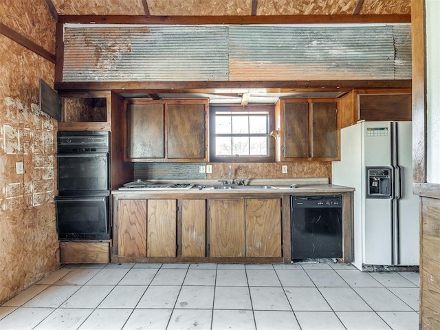 kitchen featuring tasteful backsplash, sink, and black appliances