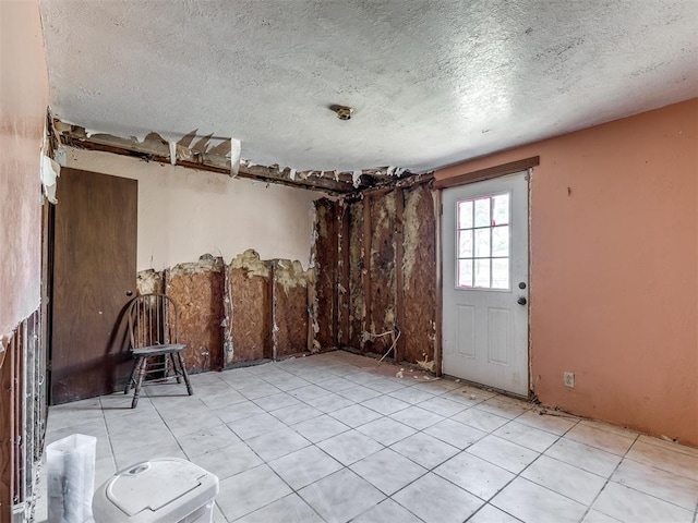 interior space with a textured ceiling