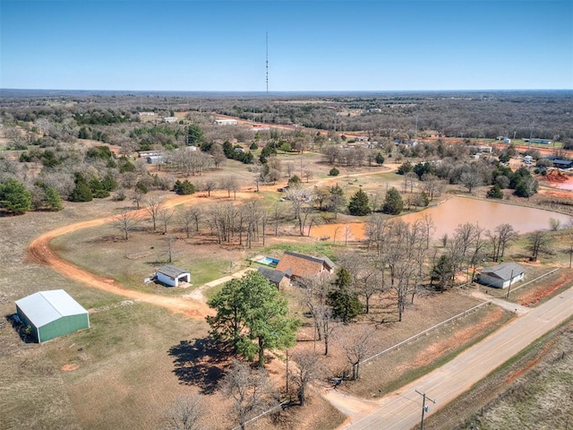 birds eye view of property with a water view and a rural view