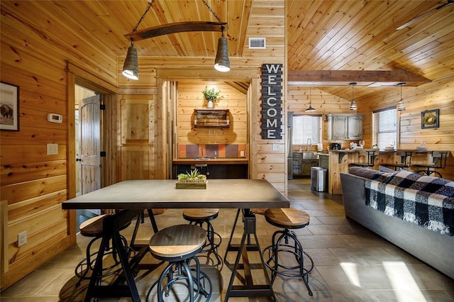 44 Blue Ivey Cir, Broken Bow, OK 74728 - dining area with wood walls and wood ceiling