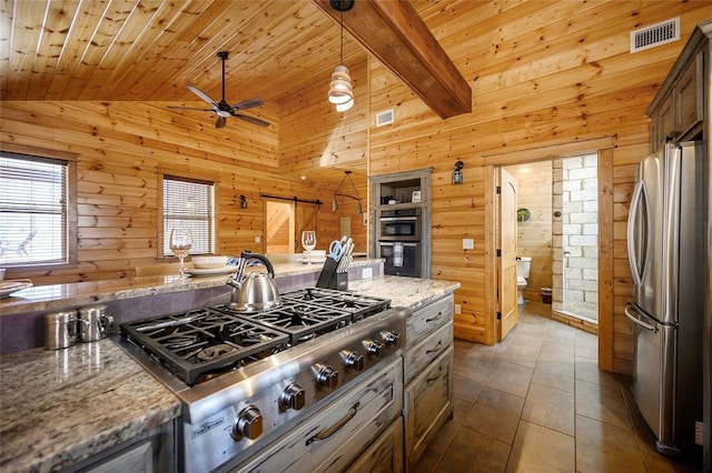 44 Blue Ivey Cir, Broken Bow, OK 74728 - kitchen featuring stainless steel appliances, wood walls, wood ceiling, a ceiling fan, and light stone counters