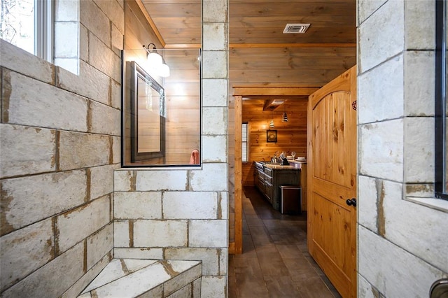 bathroom with vanity, hardwood / wood-style flooring, wooden walls, and wood ceiling