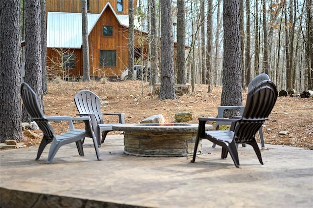 view of patio with a fire pit