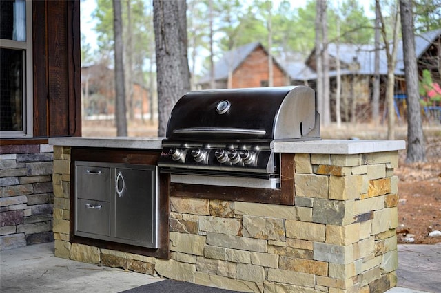 view of patio / terrace with an outdoor kitchen and grilling area