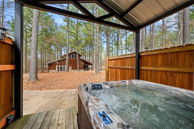 44 Blue Ivey Cir, Broken Bow, OK 74728 - deck with an outdoor structure and a hot tub