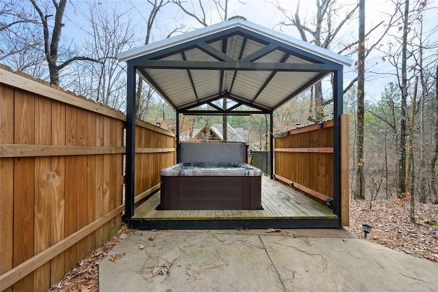 44 Blue Ivey Cir, Broken Bow, OK 74728 - view of patio / terrace with a hot tub, a gazebo, and a wooden deck