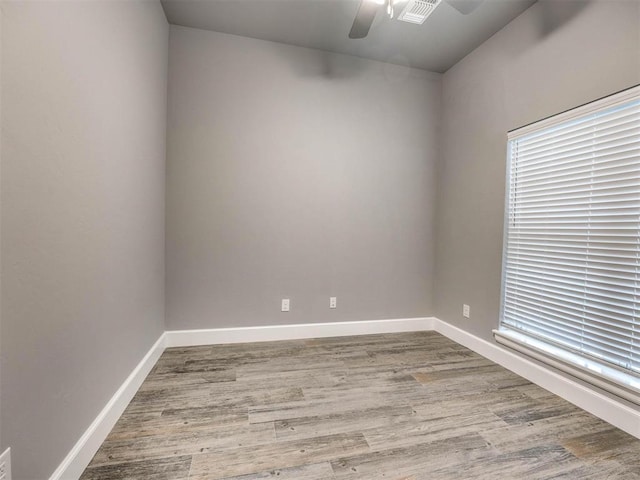 spare room featuring ceiling fan and light hardwood / wood-style flooring