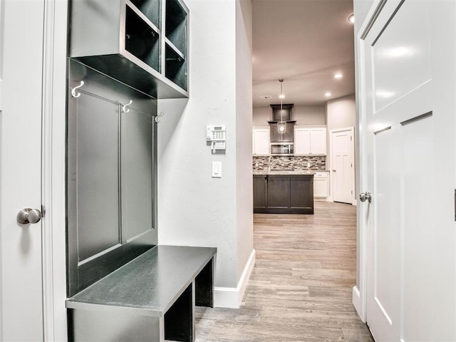 mudroom with light wood-type flooring