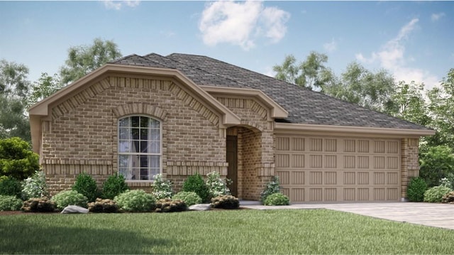 view of front of house with a front yard and a garage