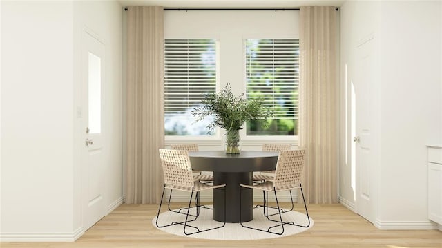 dining space with light hardwood / wood-style flooring