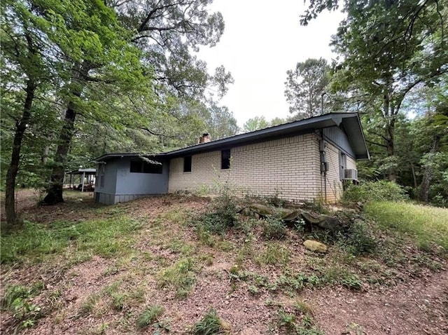 view of side of property with cooling unit