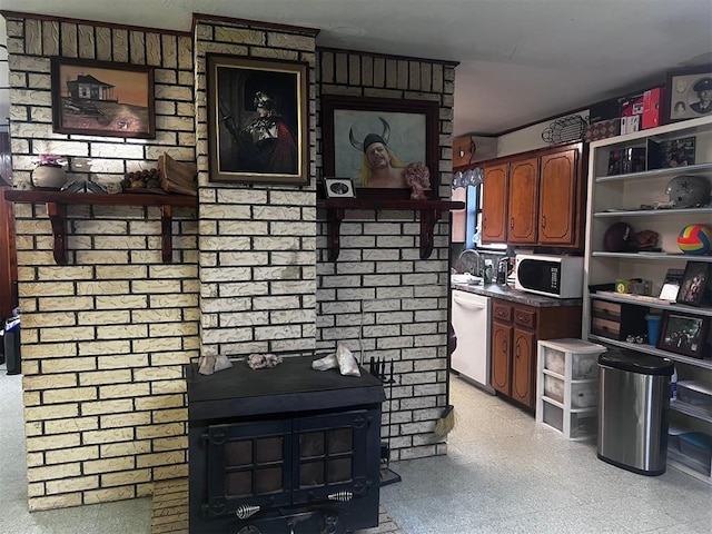 kitchen with a wood stove and dishwasher