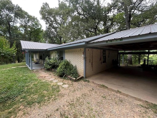 view of home's exterior with a carport