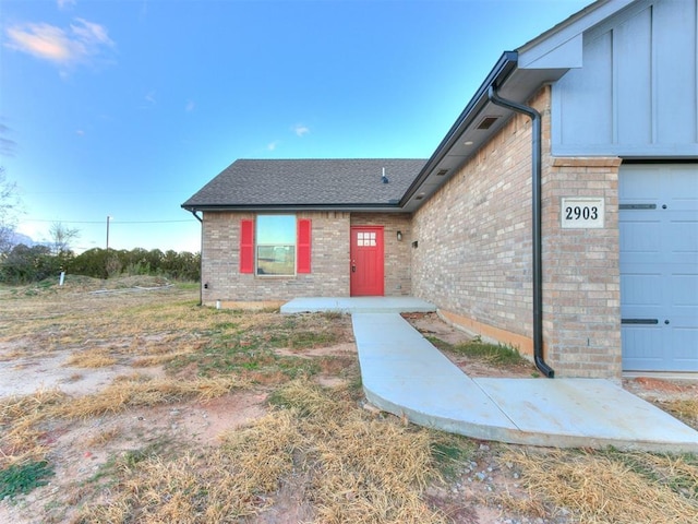 property entrance with a garage