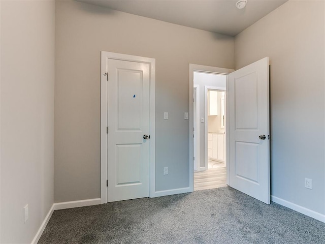 unfurnished bedroom featuring carpet flooring