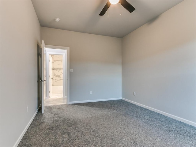 unfurnished room with carpet, baseboards, and ceiling fan