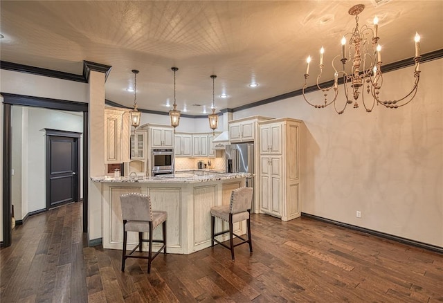 kitchen featuring an inviting chandelier, light stone counters, hanging light fixtures, and dark wood-type flooring