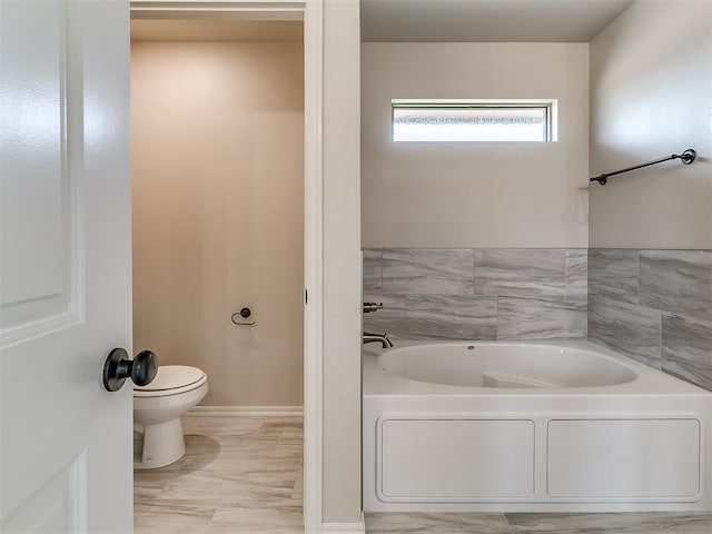 bathroom with a bath and toilet