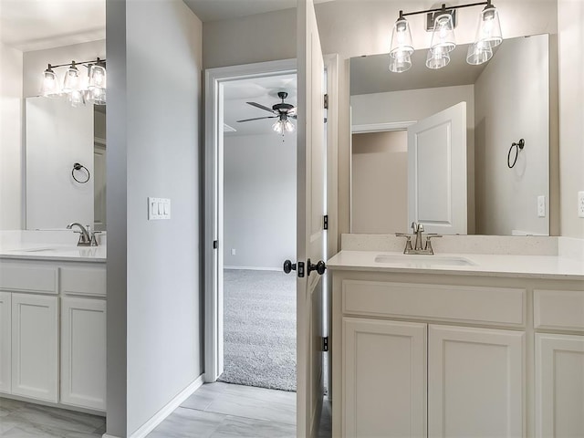 bathroom with ceiling fan and vanity