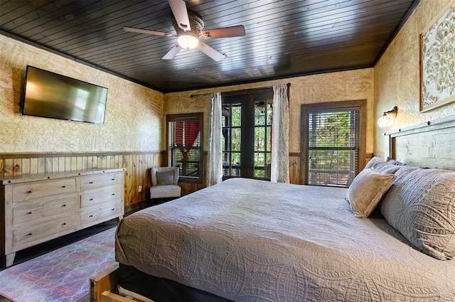 bedroom featuring ceiling fan, wooden ceiling, access to outside, and french doors