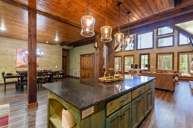 kitchen featuring wood ceiling, wooden walls, decorative light fixtures, dark hardwood / wood-style floors, and a kitchen island