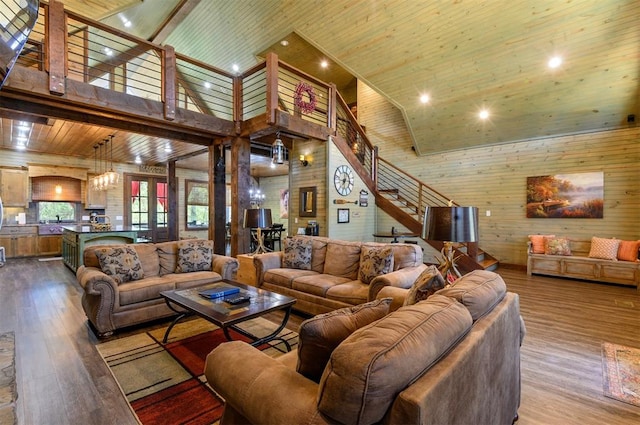 living room featuring french doors, wood ceiling, hardwood / wood-style flooring, high vaulted ceiling, and wood walls