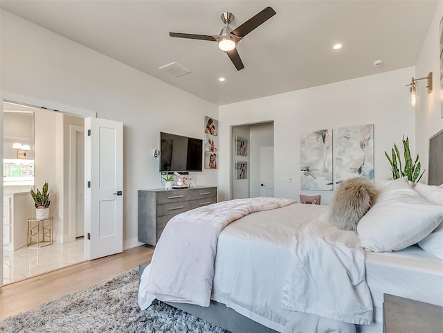 bedroom with ceiling fan and light wood-type flooring