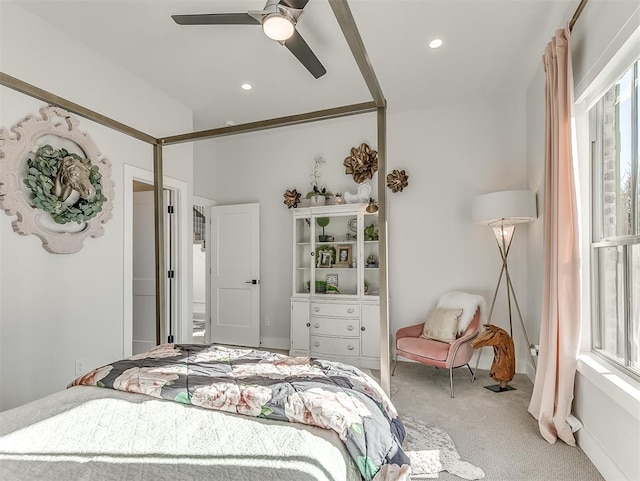 bedroom with carpet flooring, multiple windows, and ceiling fan