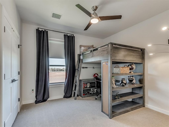 bedroom featuring ceiling fan and light colored carpet