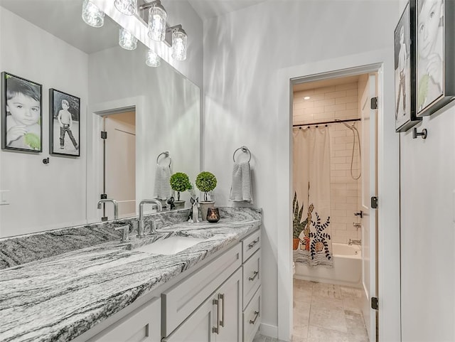 bathroom featuring vanity and shower / bathtub combination with curtain