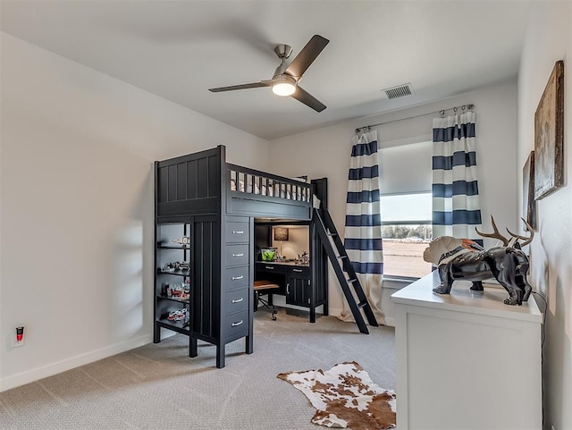 carpeted bedroom with ceiling fan