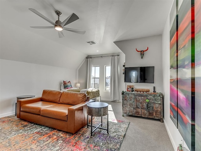 carpeted living room featuring ceiling fan and lofted ceiling