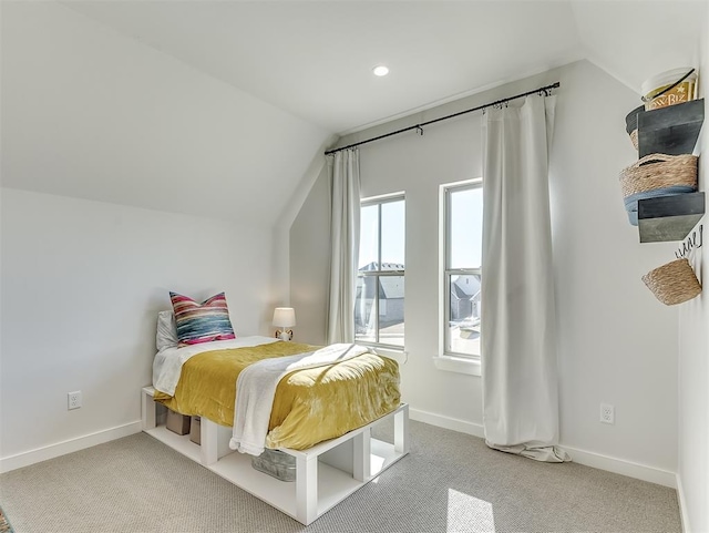 carpeted bedroom featuring vaulted ceiling